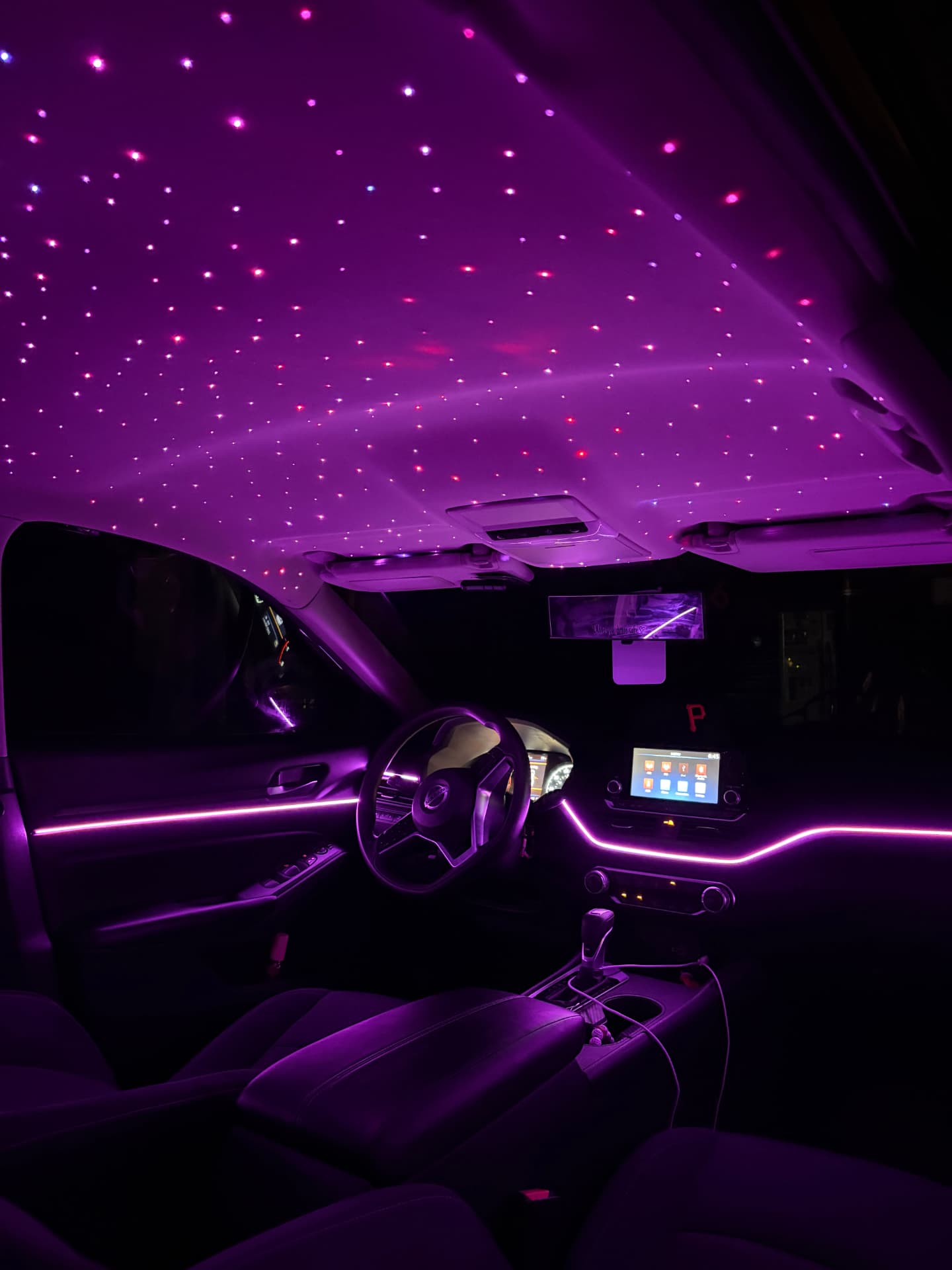 Purple starlight headliner and ambient lighting installed by Navarrete Customz